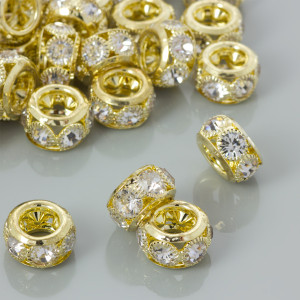 Koralik oponka z kryształkami w okuciu koloru złotego 16x9mm